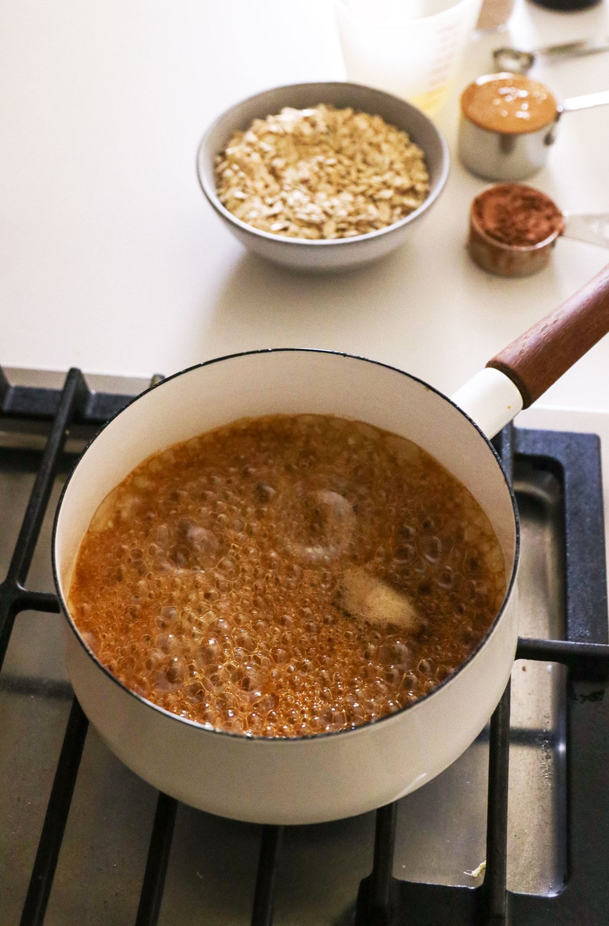 maple syrup boiling with ingredients nearby