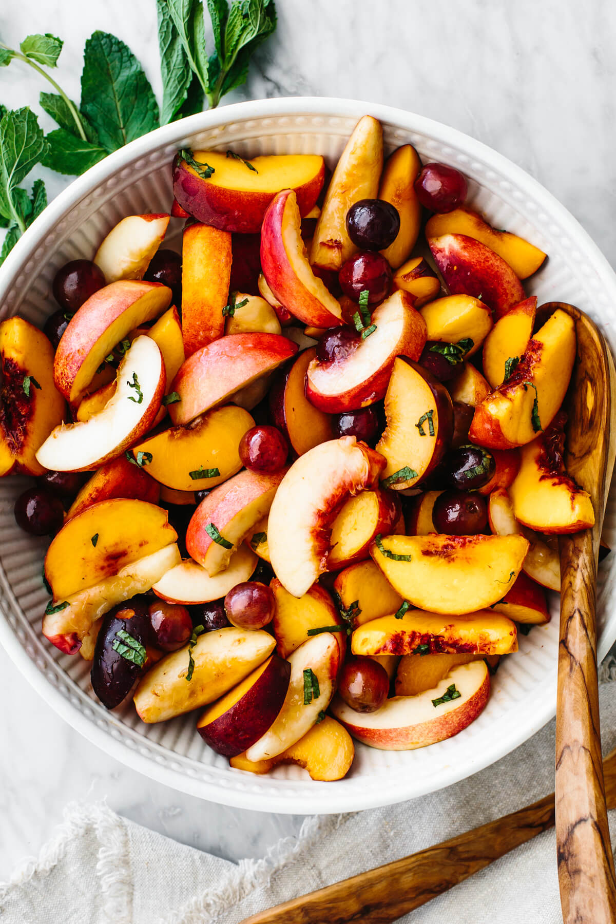 Stone fruit salad in a large serving bowl
