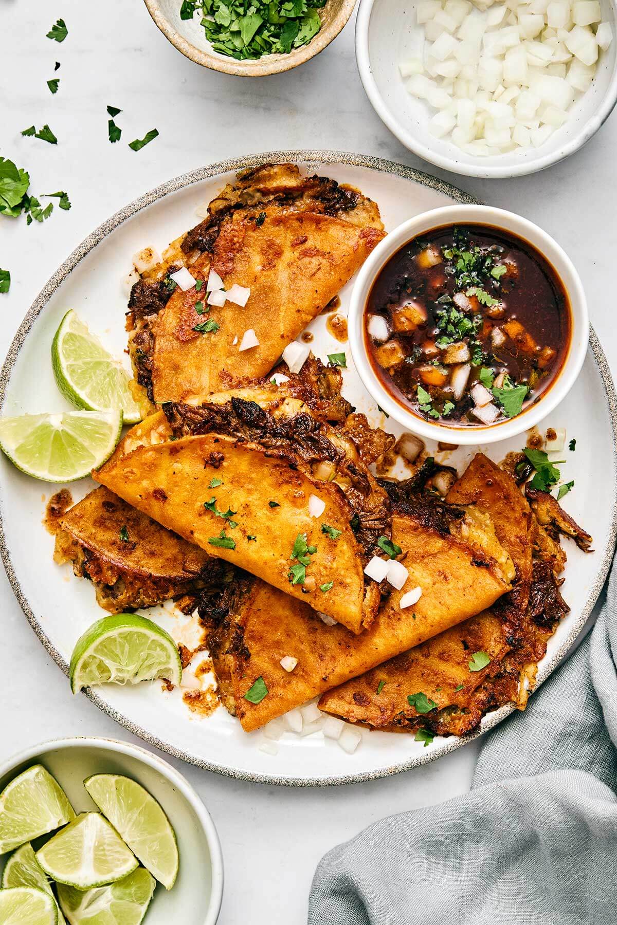Birria tacos on a plate.