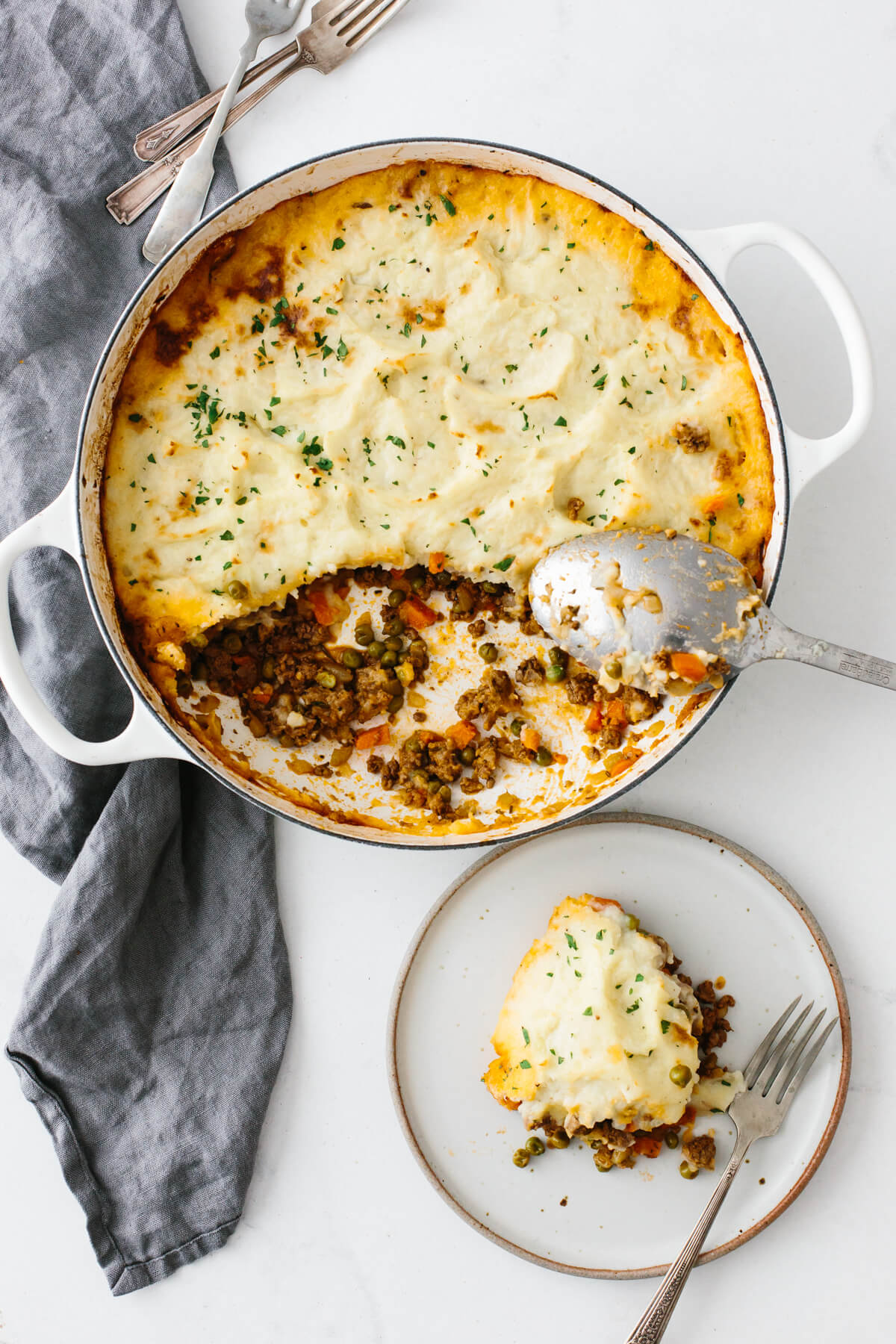 Shepherd's pie on a table next to a napkin