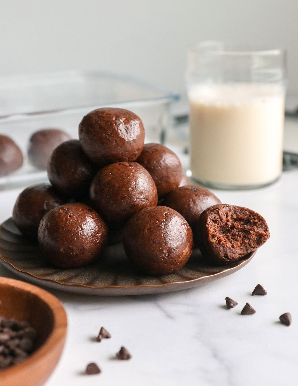 Chocolate protein balls with dates on a plate.