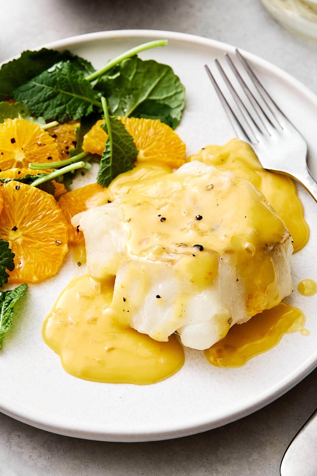 Baked cod with orange beurre blanc.