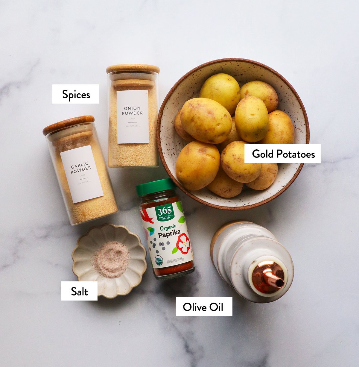 potatoes, spices, and olive oil labeled in jars.