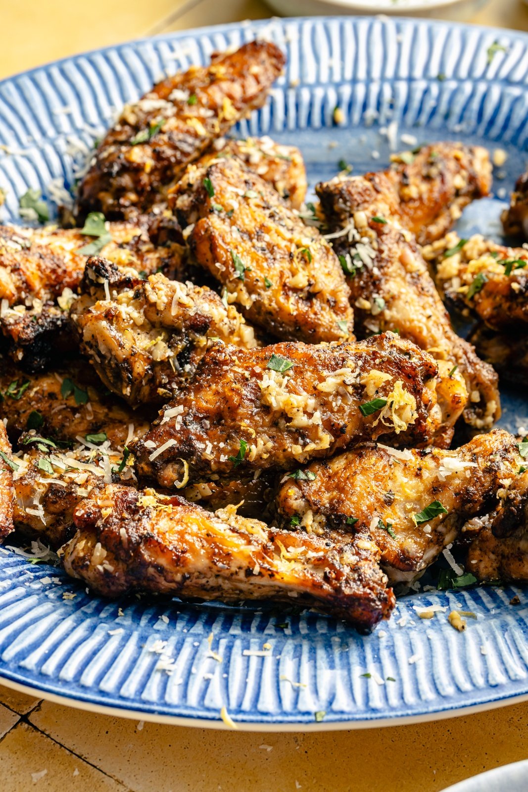 lemon garlic parmesan chicken wings on a platter