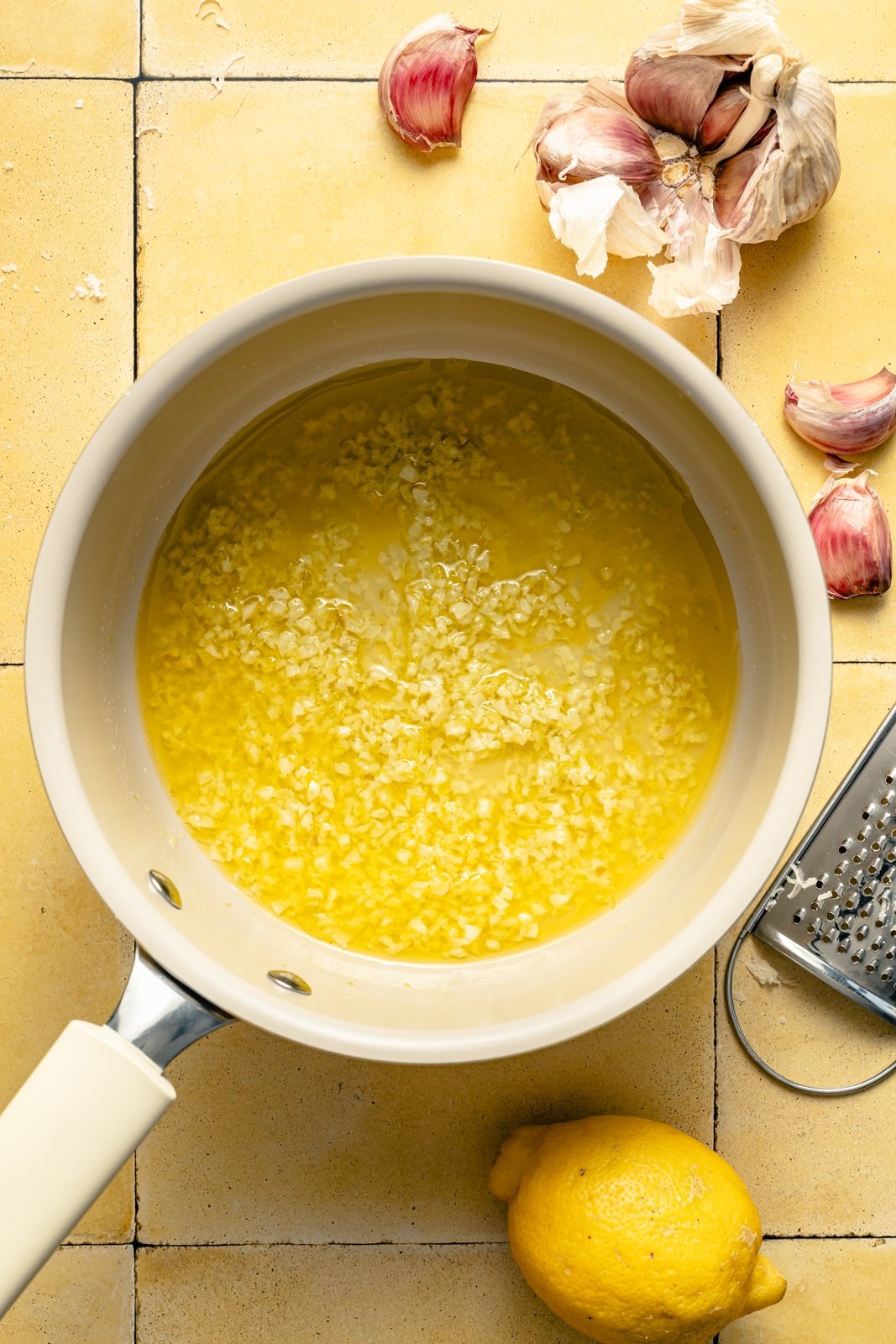 lemon garlic butter sauce in a pot for lemon parmesan wings