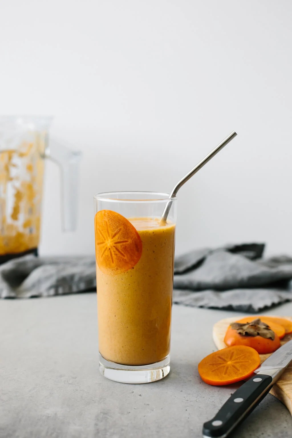 This persimmon smoothie is the perfect smoothie for fall. Made with persimmons, banana, ginger, cinnamon and cloves, it's slightly spiced and deliciously sweet.