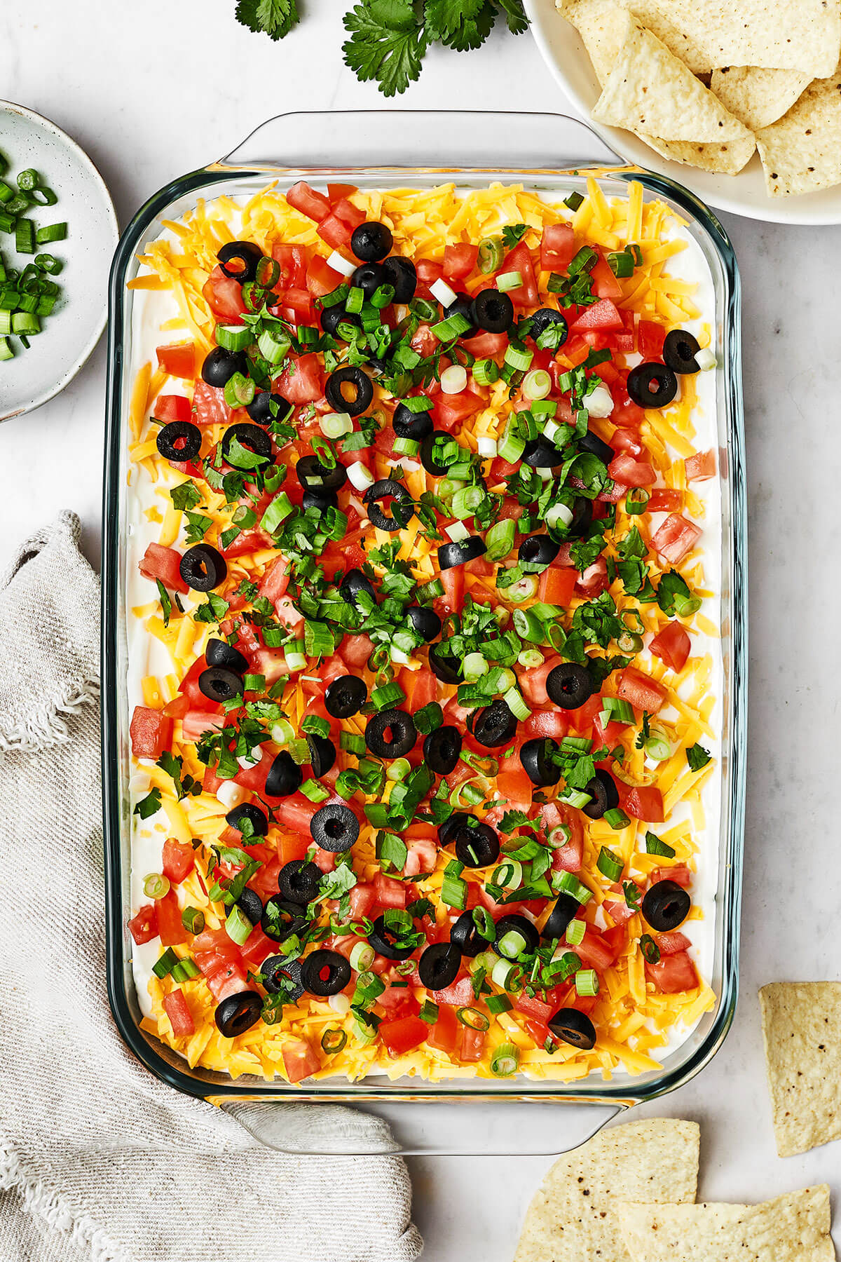 A large baking dish of 7 layer dip