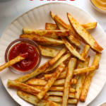 air fryer french fries on a plate labeled for Pinterest.