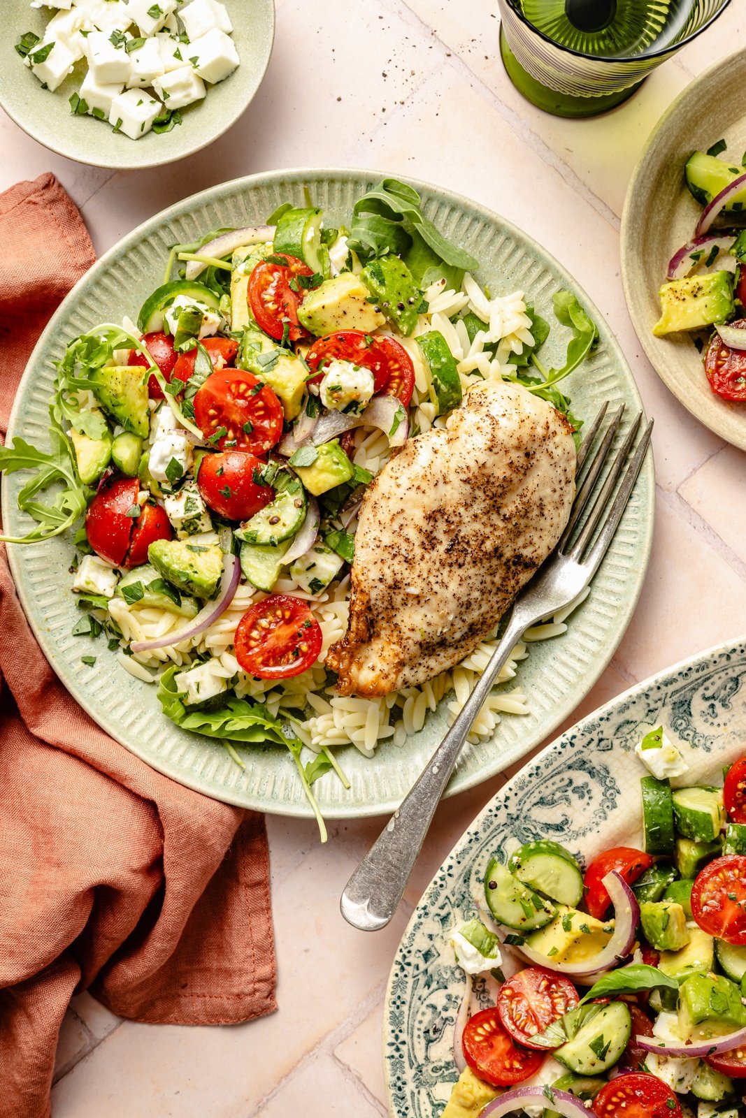 cucumber tomato salad on a plate with chicken