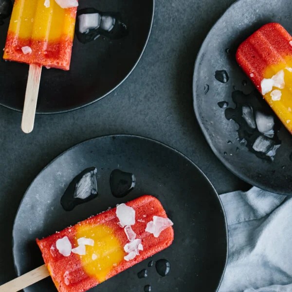 Mango strawberry popsicles are the perfect homemade popsicle recipe to usher in warmer spring weather with delicious, seasonal fruit.