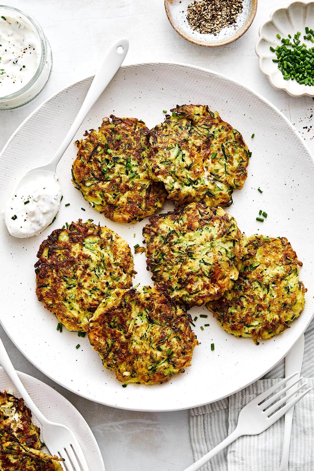 Zucchini fritters on a plate.