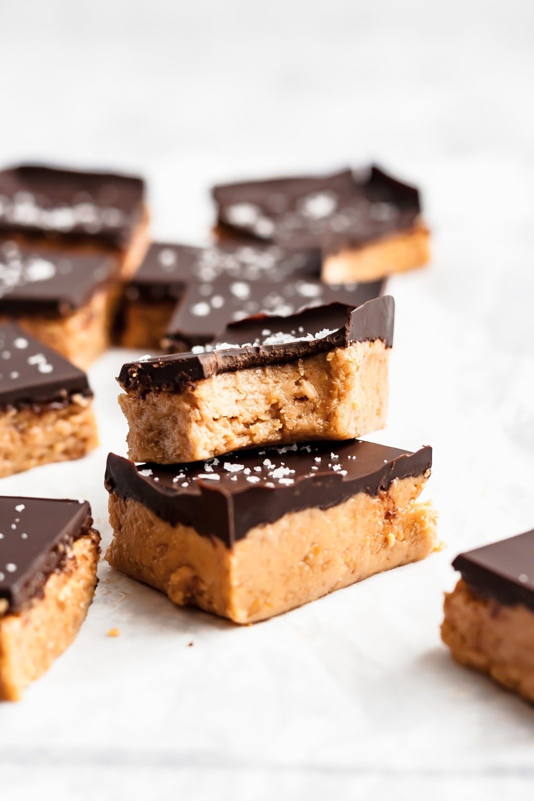 two chocolate peanut butter protein bars in a stack