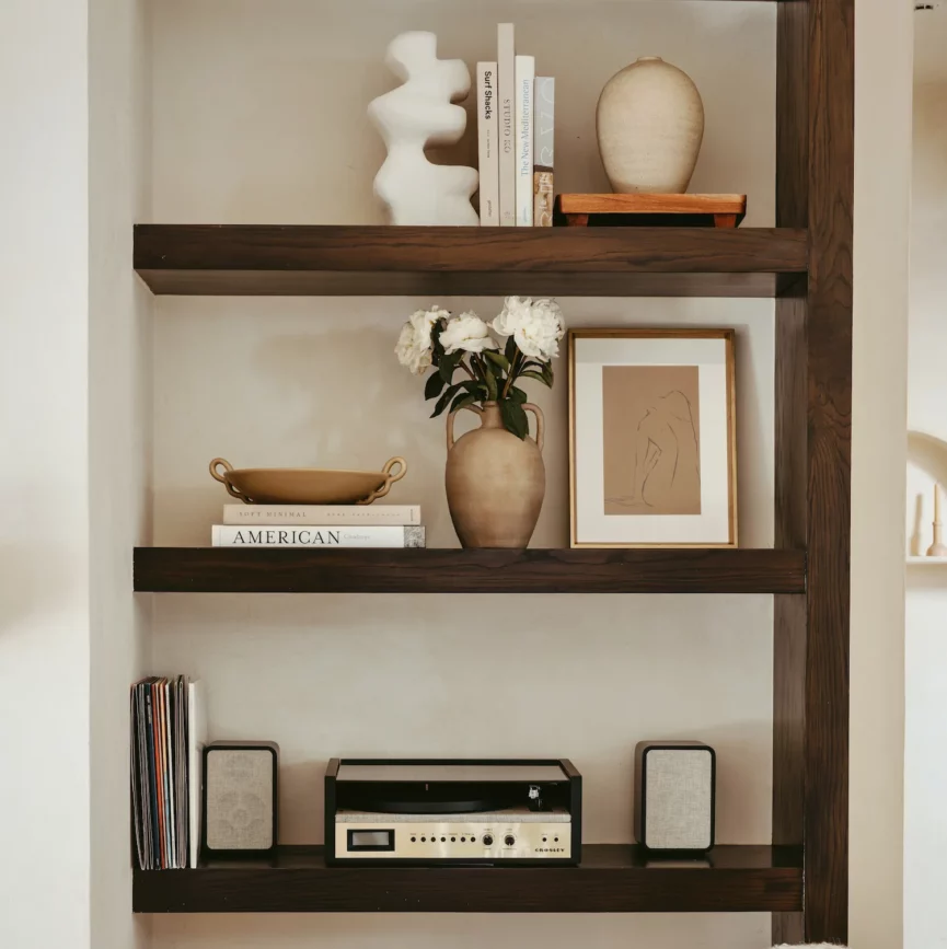 terracotta urn vessel on bookshelf