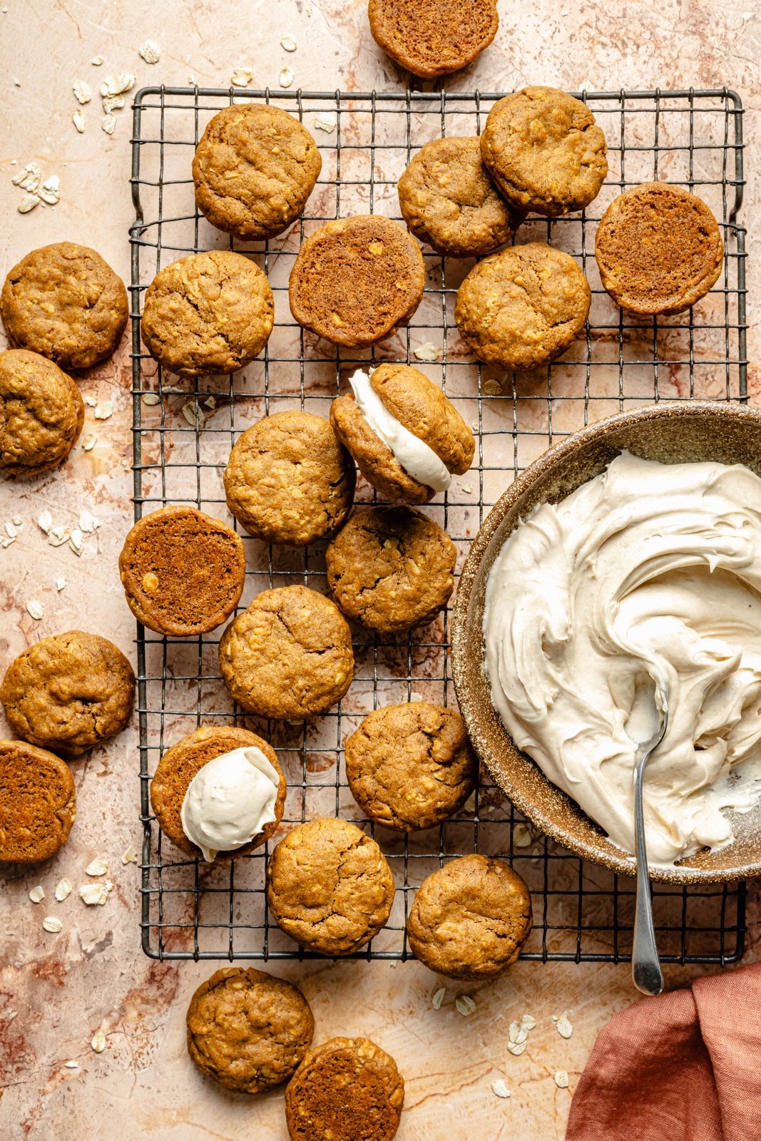 assembling pumpkin oatmeal cream pies on a wire rack