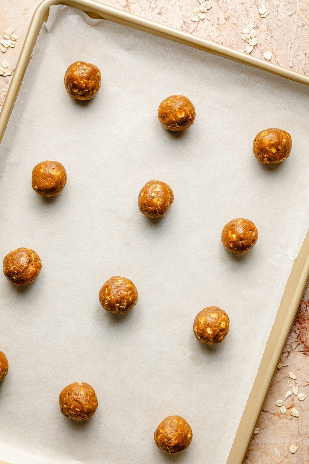 unbaked pumpkin sandwich cookies on a baking sheet
