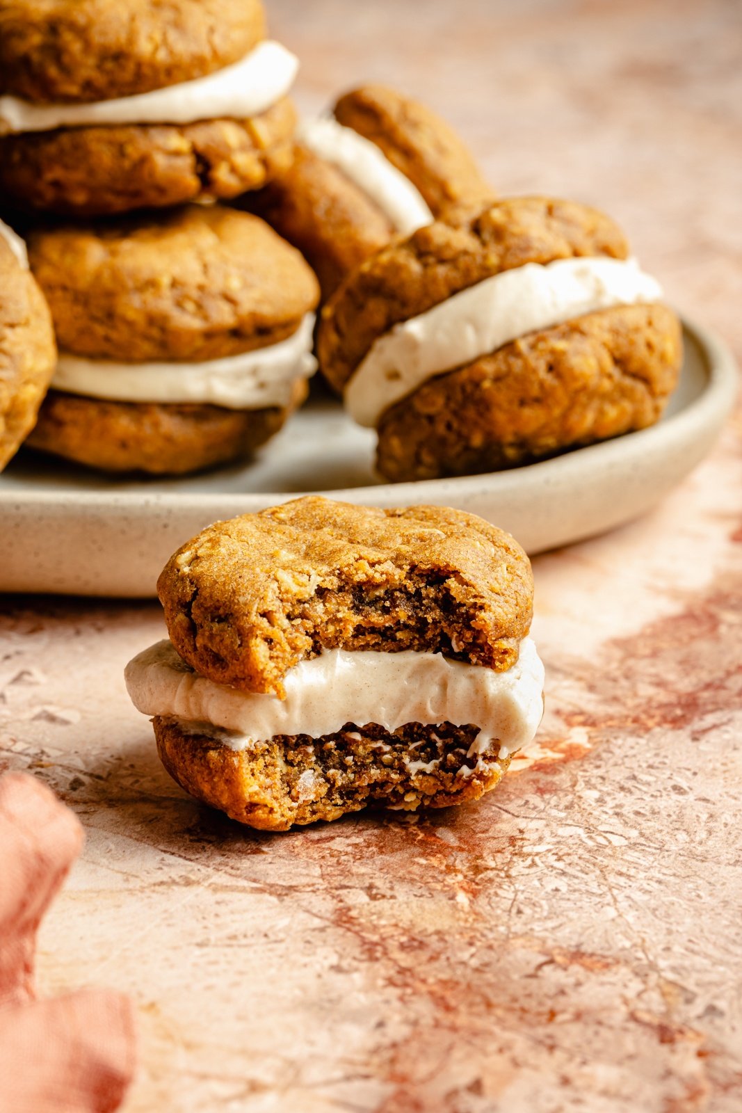 pumpkin oatmeal cream pie with a bite taken out