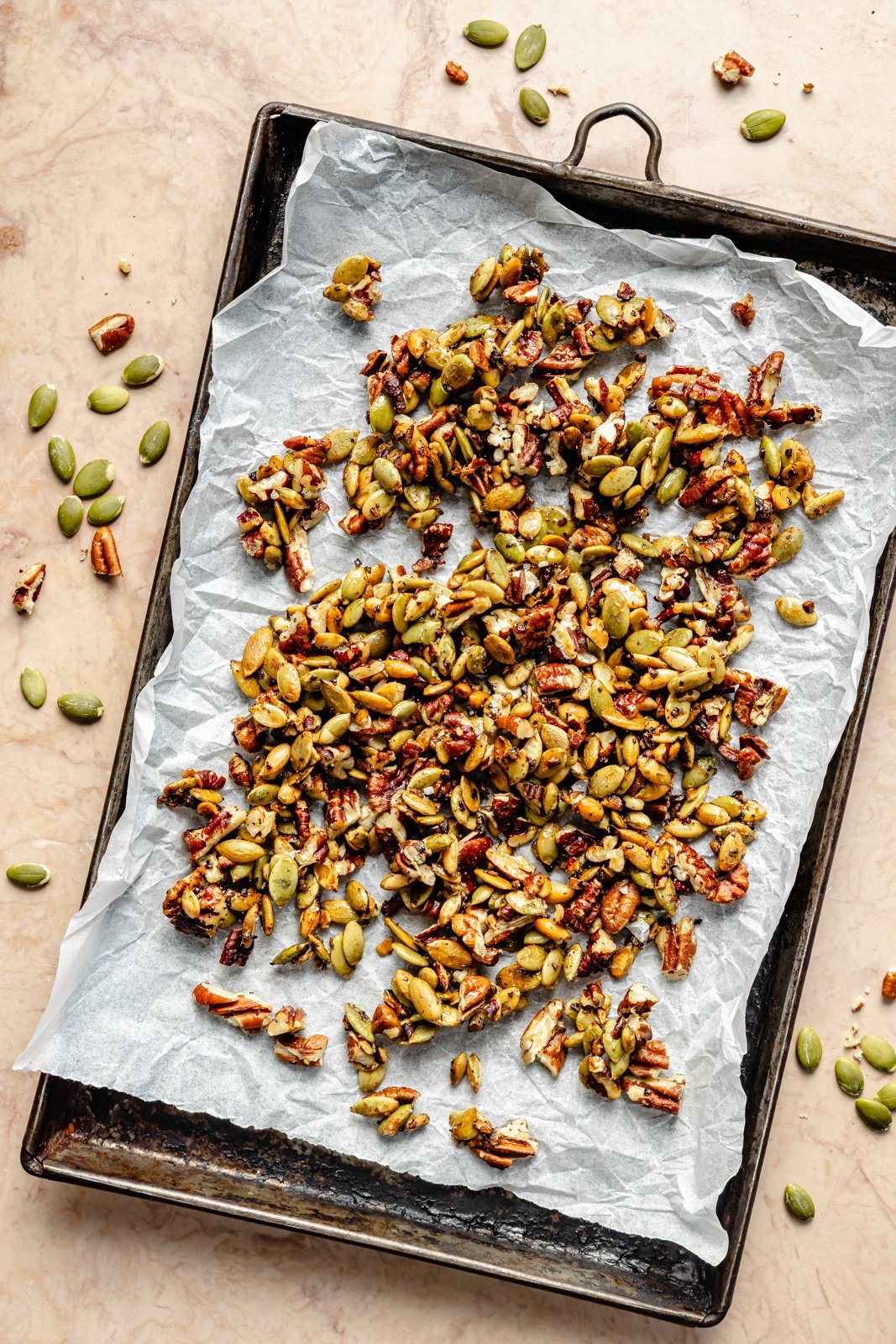 toasting nuts on a sheet pan for an apple farro salad