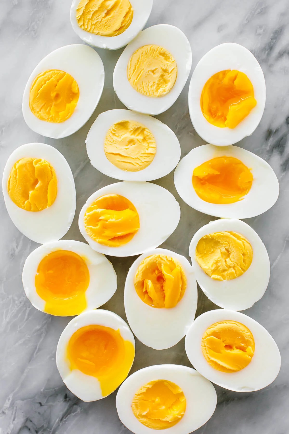 Hard boiled and soft boiled eggs on a counter