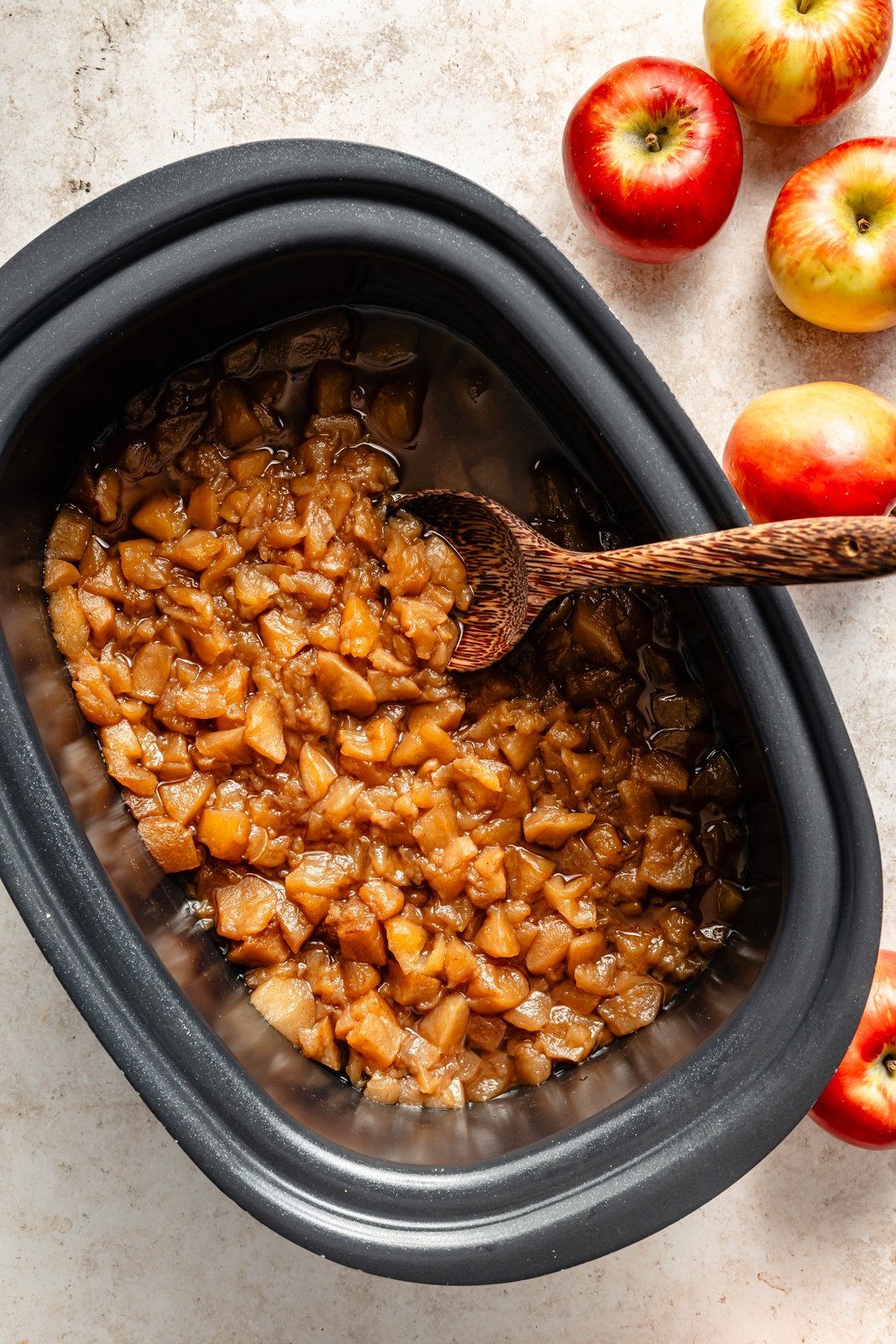 ingredients for slow cooker applesauce in a crock pot