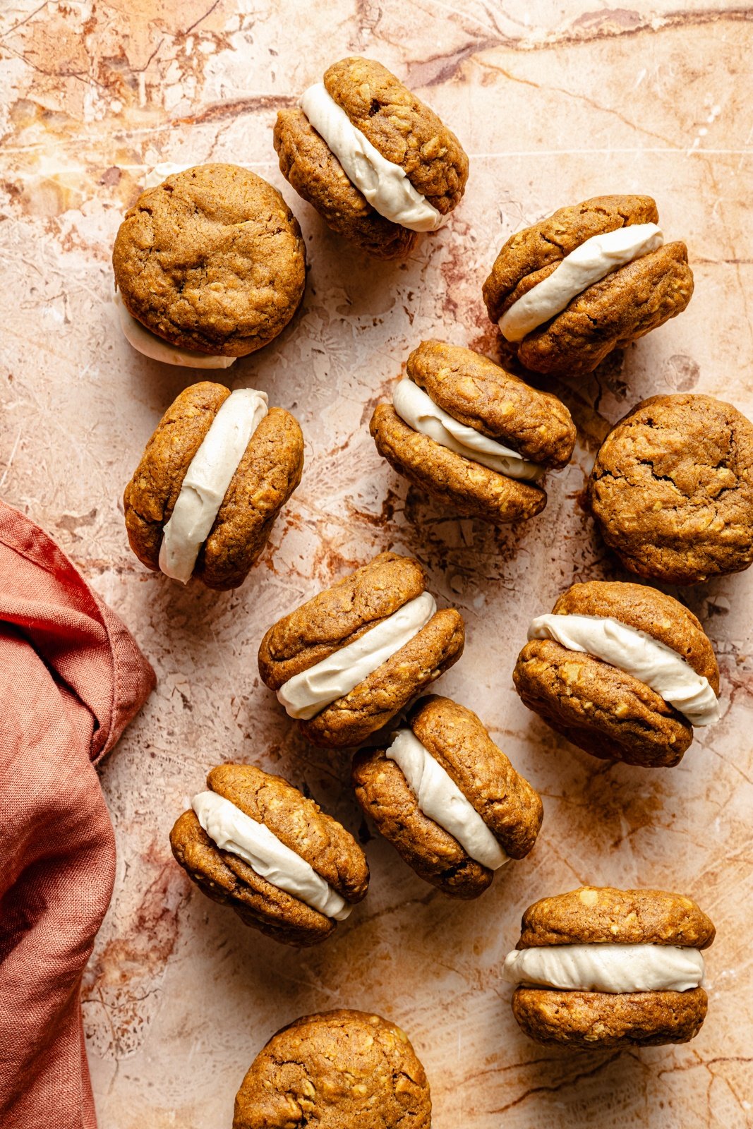 pumpkin sandwich cookies on a board