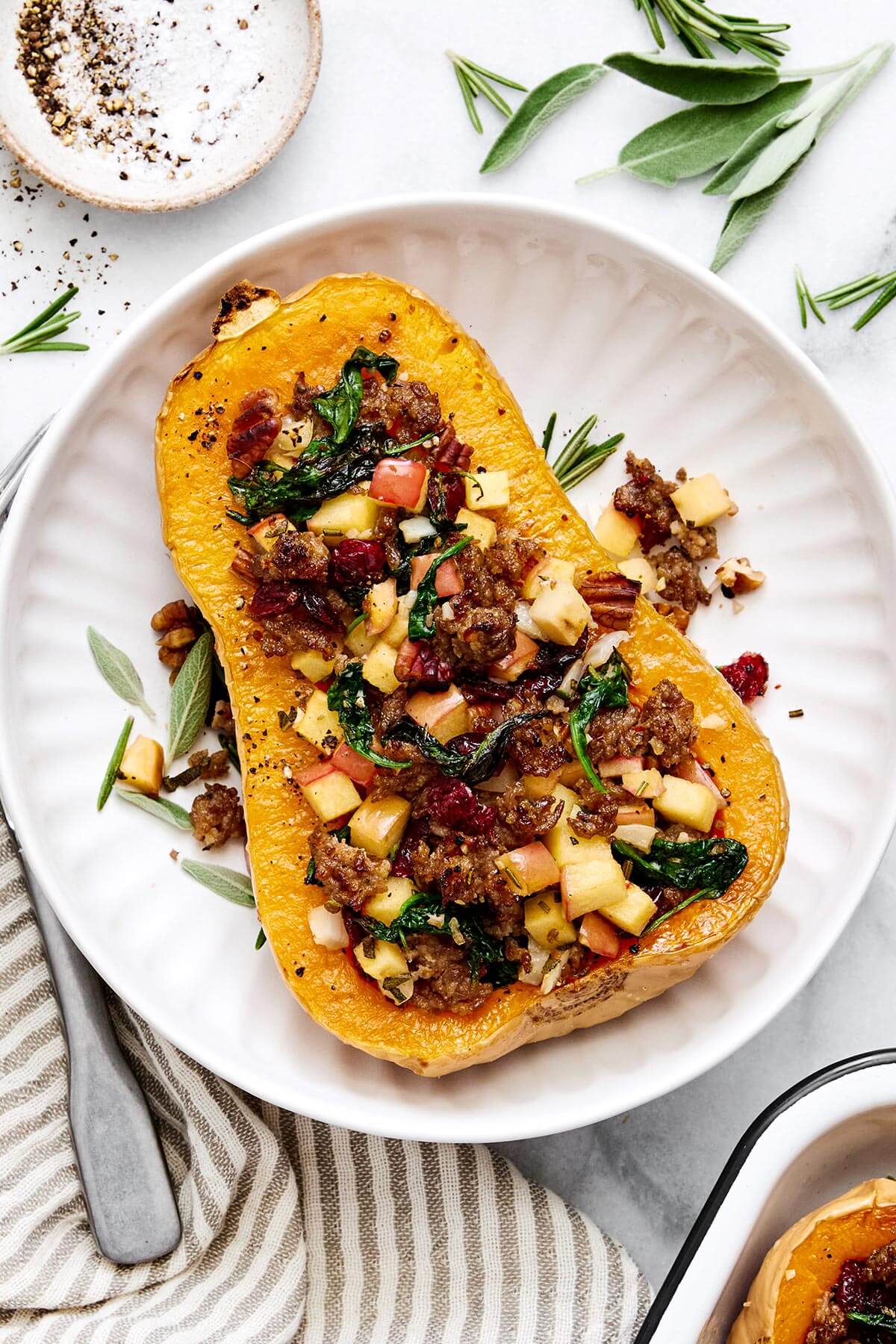 Apple sausage stuffed butternut squash with cranberries.