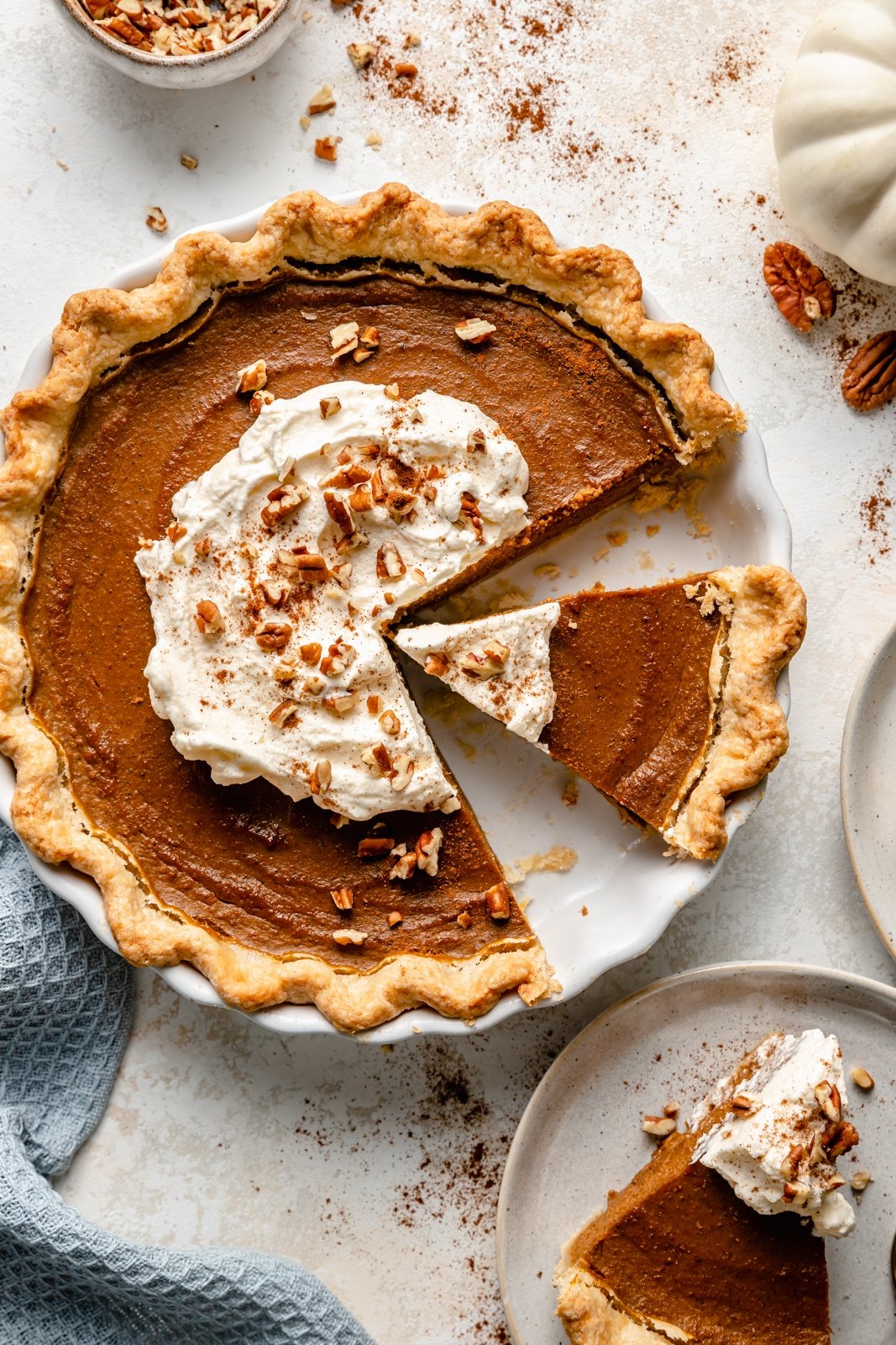 healthy pumpkin pie with whipped cream in a pan