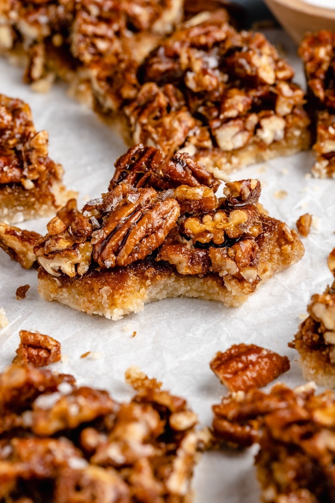 vegan pecan pie bar with a bite taken out