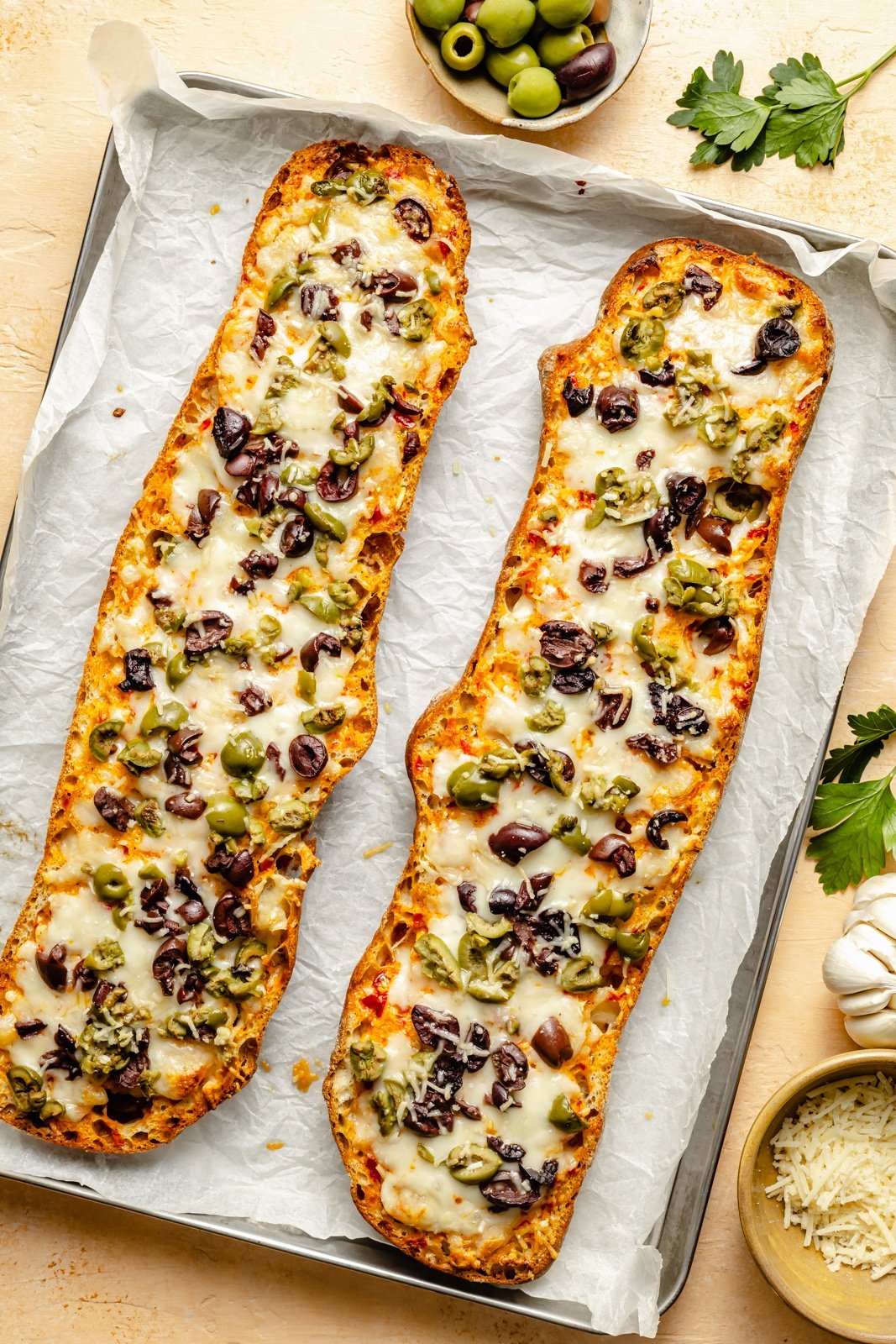 baked olive and cheese bread on a baking sheet