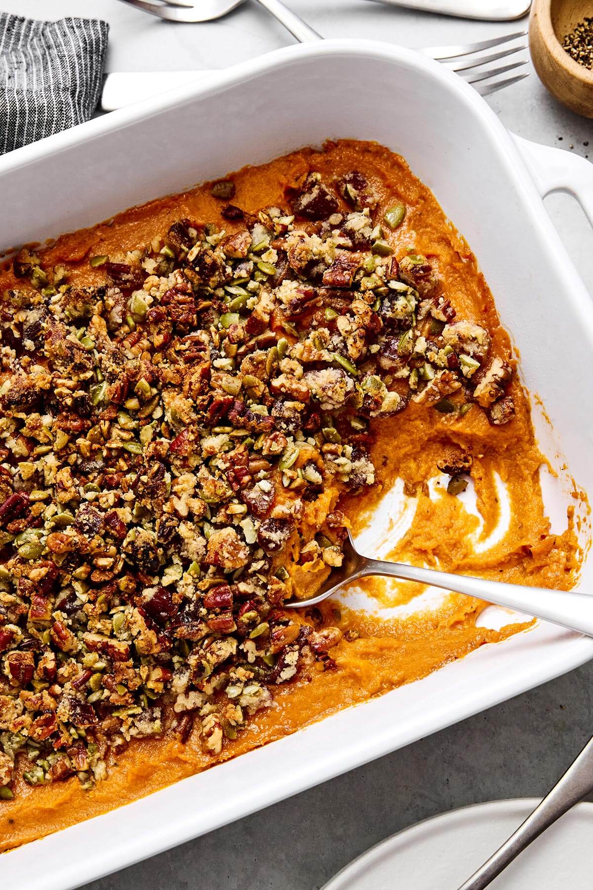 Sweet potato casserole with a spoon.