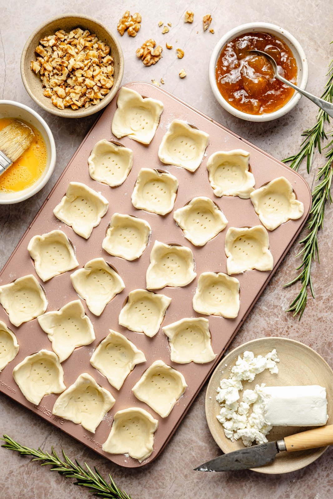 unbaked puff pastry bites in a mini muffin tin