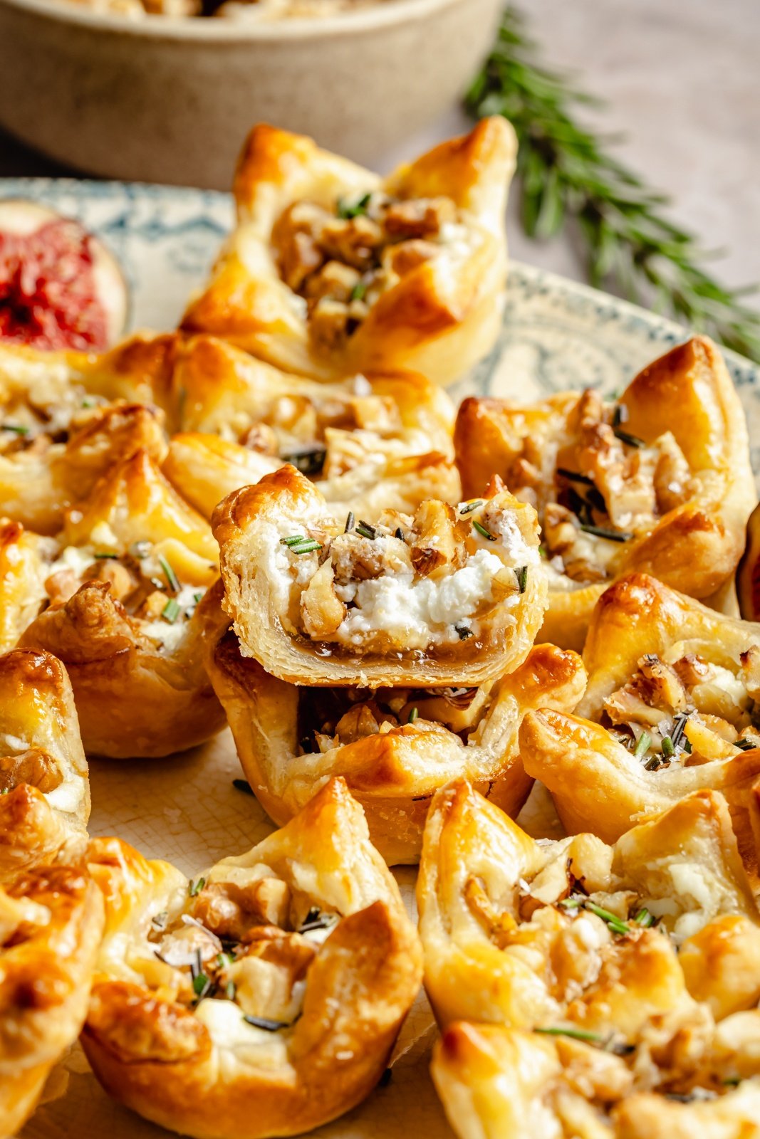 fig and goat cheese puff pastry bites on a platter