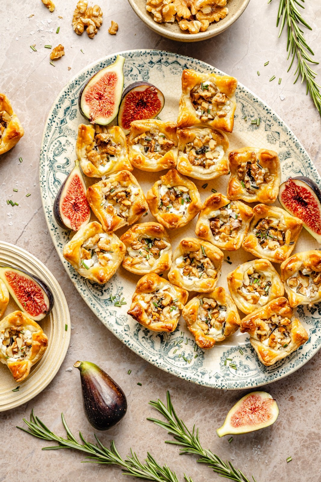 fig and goat cheese puff pastry bites on a platter