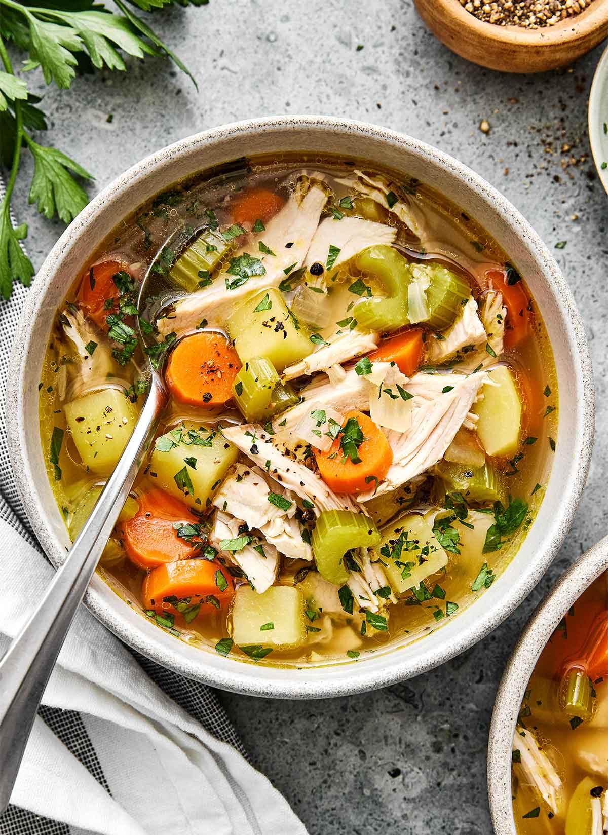 A bowl of turkey soup made with turkey leftovers.