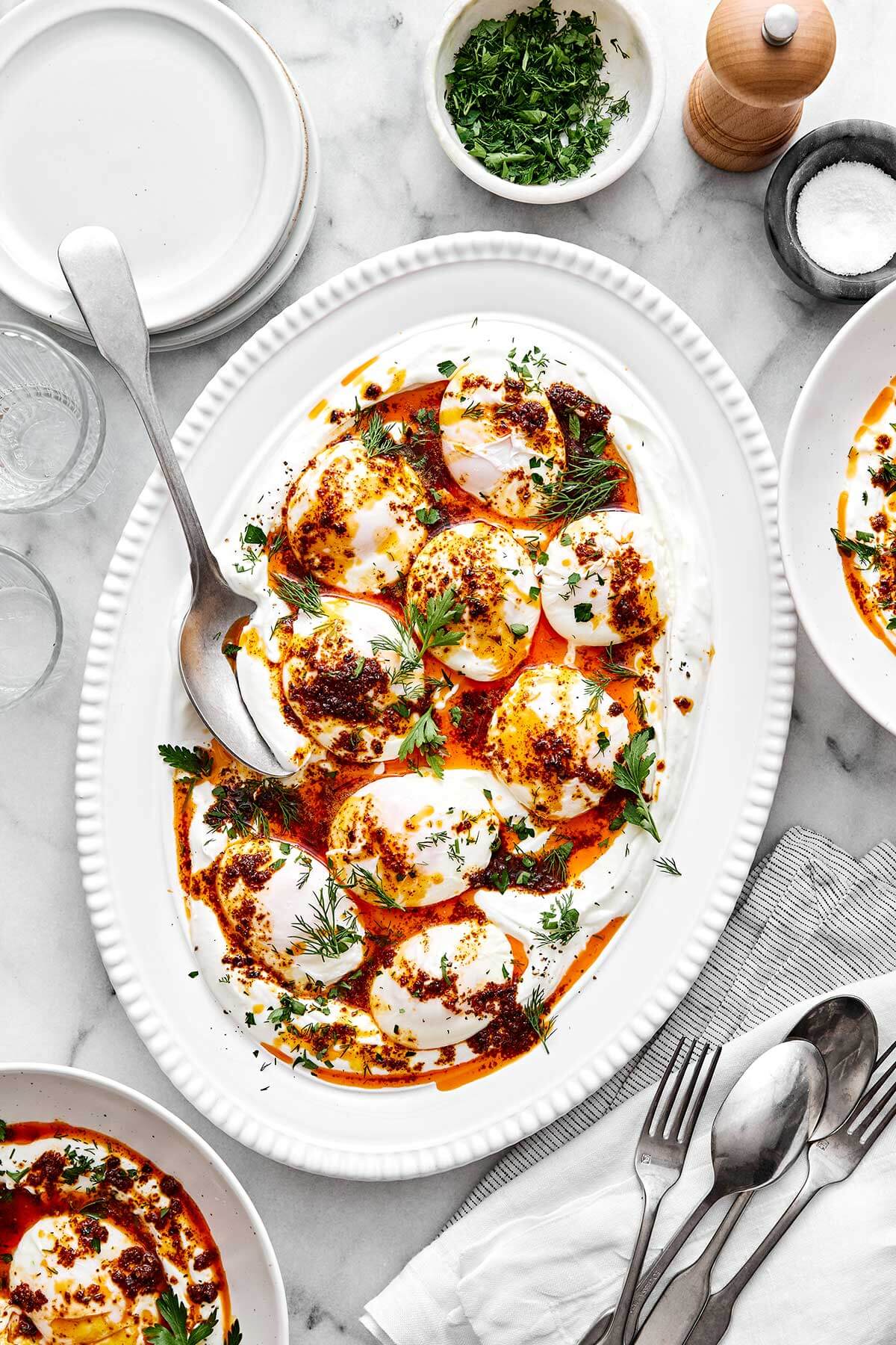 A platter of Turkish eggs for brunch for a crowd.