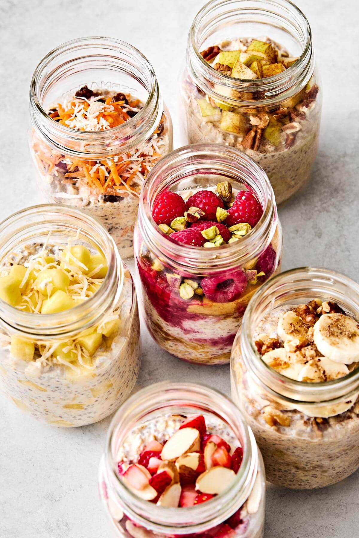 Overnight oats in many glass jars.