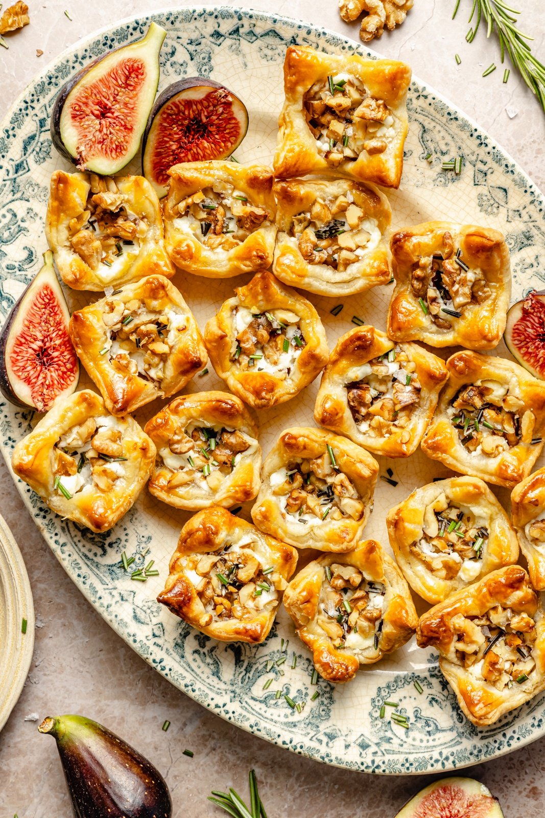 goat cheese puff pastry bites with fig jam on a platter