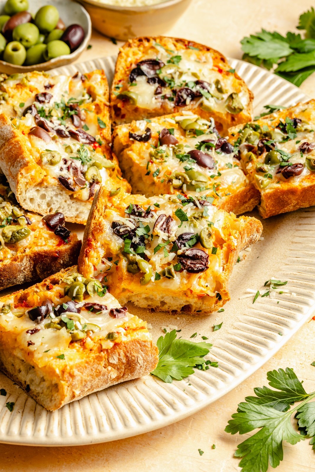olive cheese bread slices on a platter