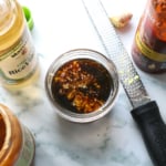 ginger and garlic grated into a jar of dressing ingredients.