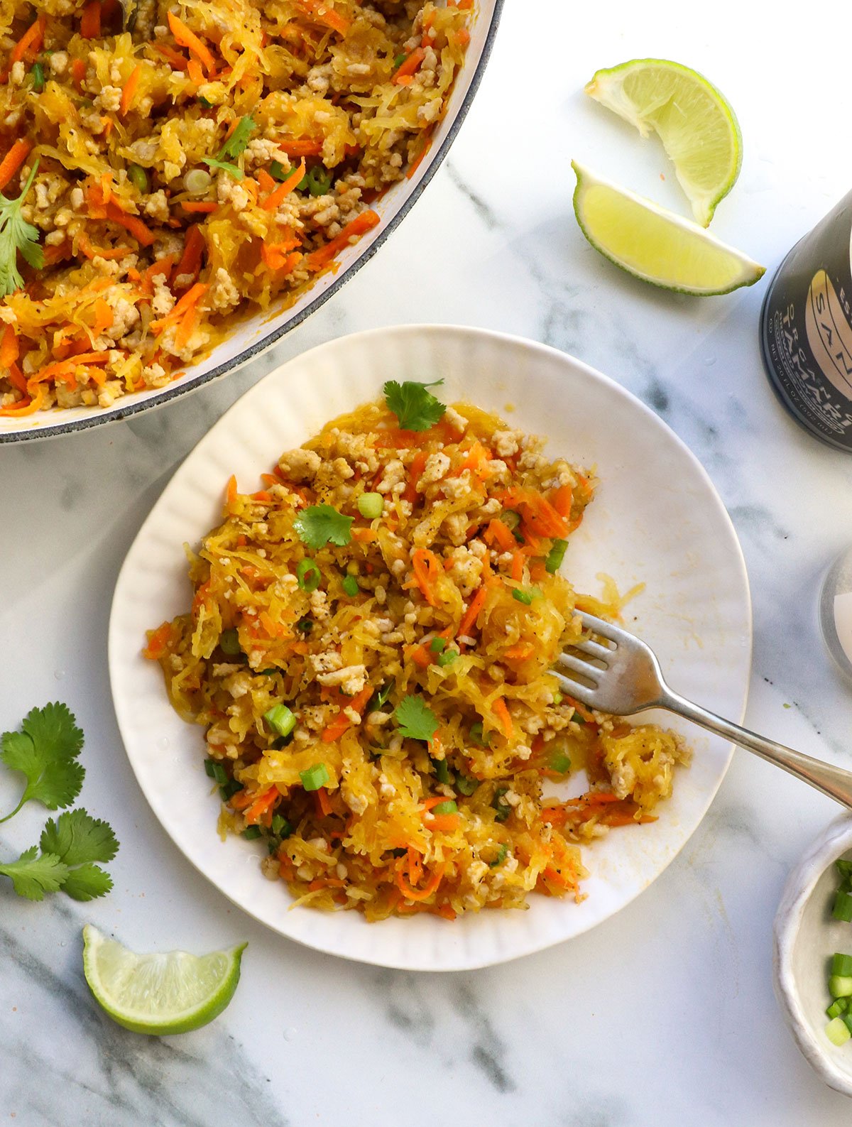 spaghetti squash chicken stir fry served on a plate with cilantro on top.