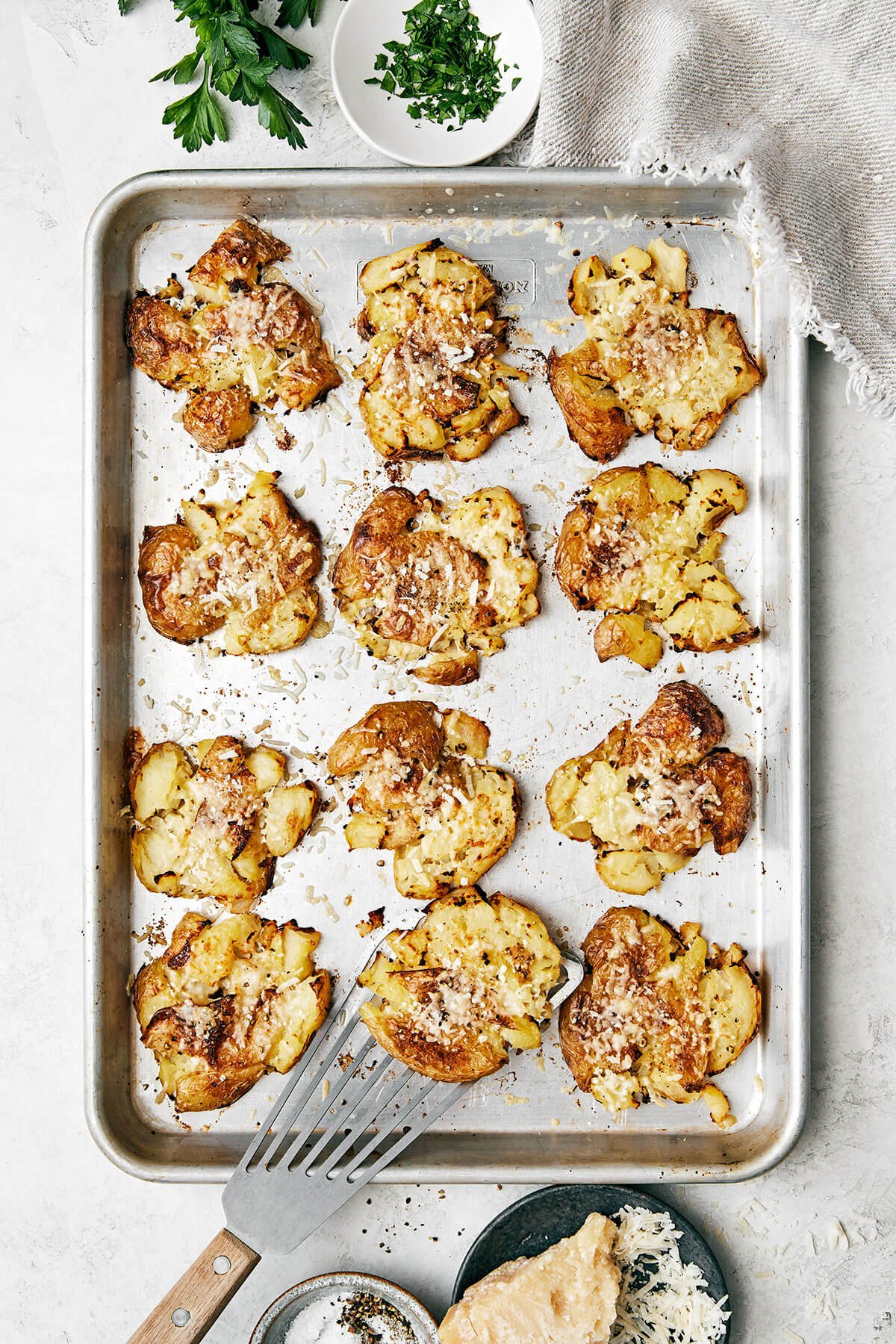 A baking sheet of smashed potatoes