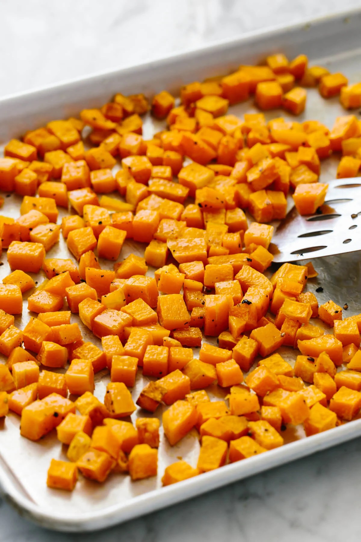 Roasted butternut squash cubes fresh out of the oven.