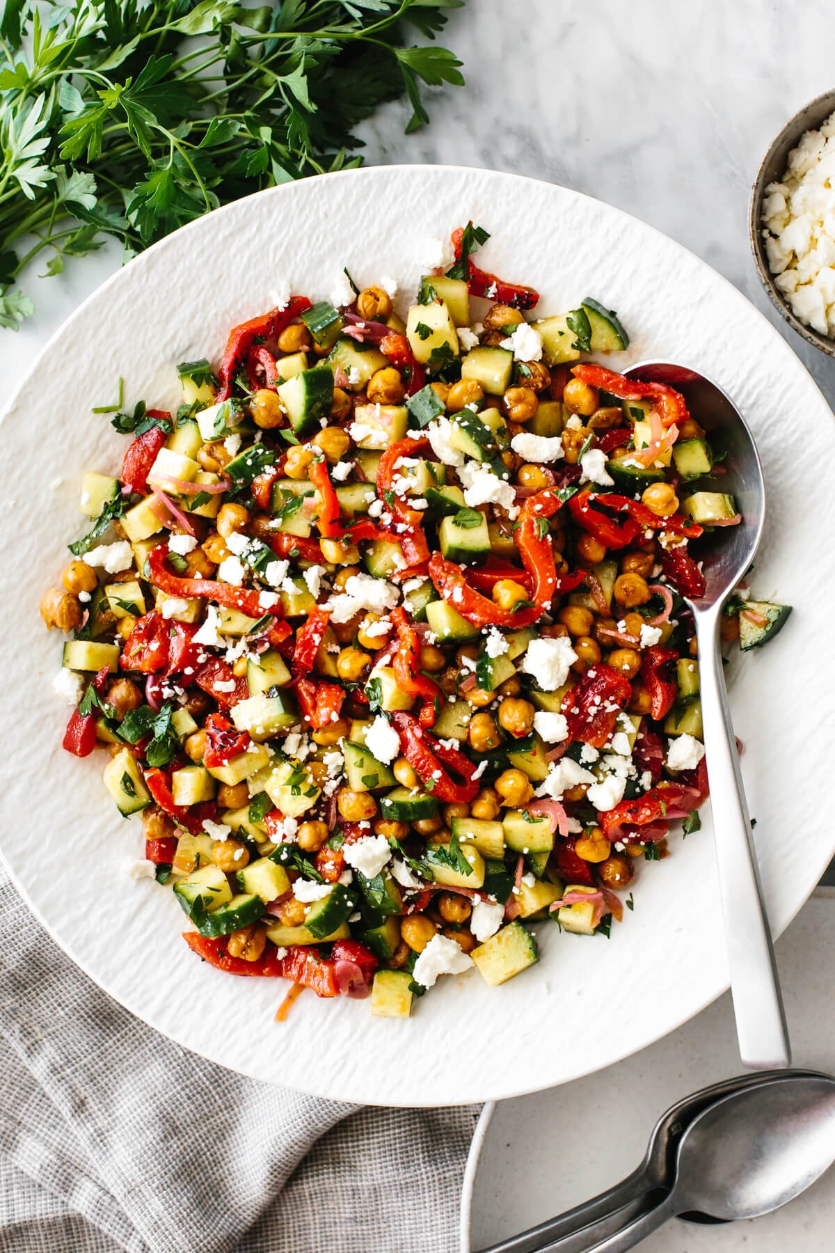 Roasted red pepper and chickpea salad in a white bowl