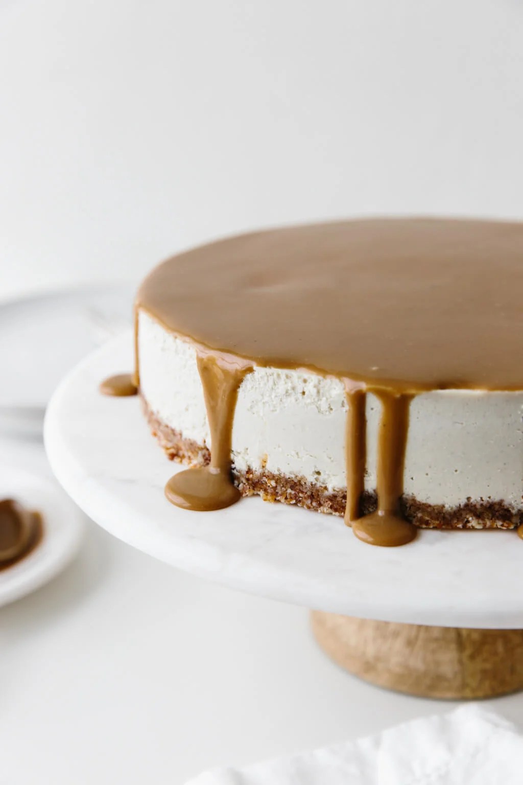 This gluten-free Vegan Caramel Cheesecake recipe is drizzled with the most amazing salted caramel sauce. The vegan cheesecake is simply made from cashews that have soaked overnight and it's super creamy and decadent.