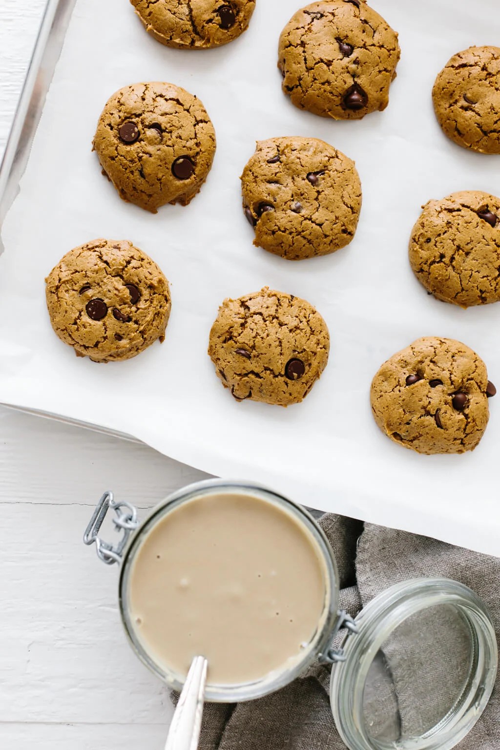 These flourless chocolate chip tahini cookies are gluten-free, nut-free and paleo. They're soft, chewy and utterly delicious. So easy to make! #TahiniCookies #Tahini #ChocolateChipCookies #CookieRecipe #Paleo #GlutenFree