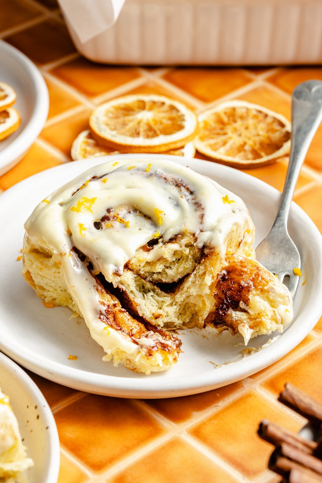 orange cinnamon roll on a plate