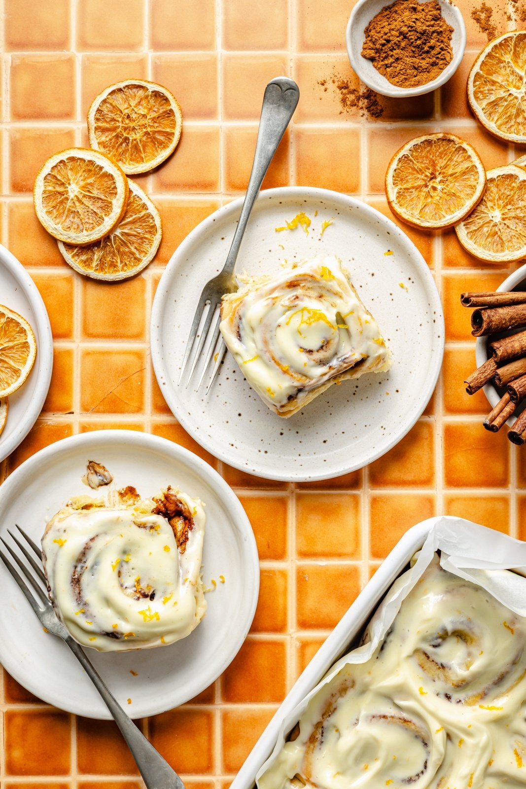 orange sweet rolls on two plates