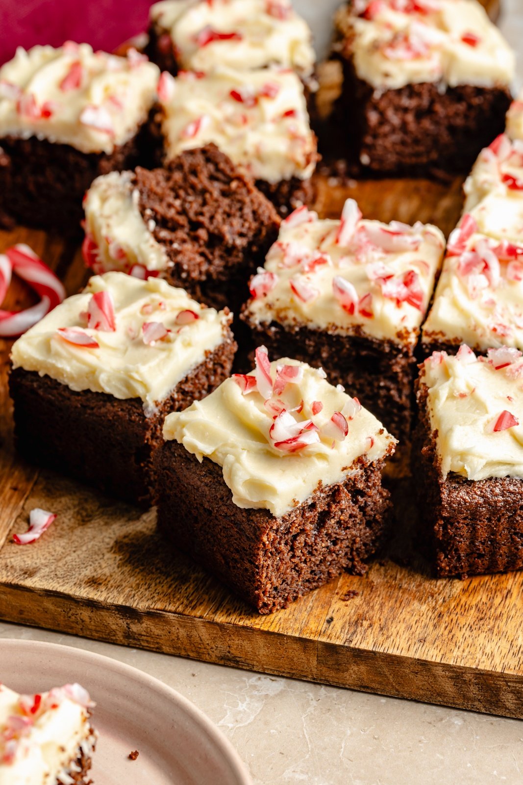 mint chocolate cake with mint frosting sliced on a cutting board