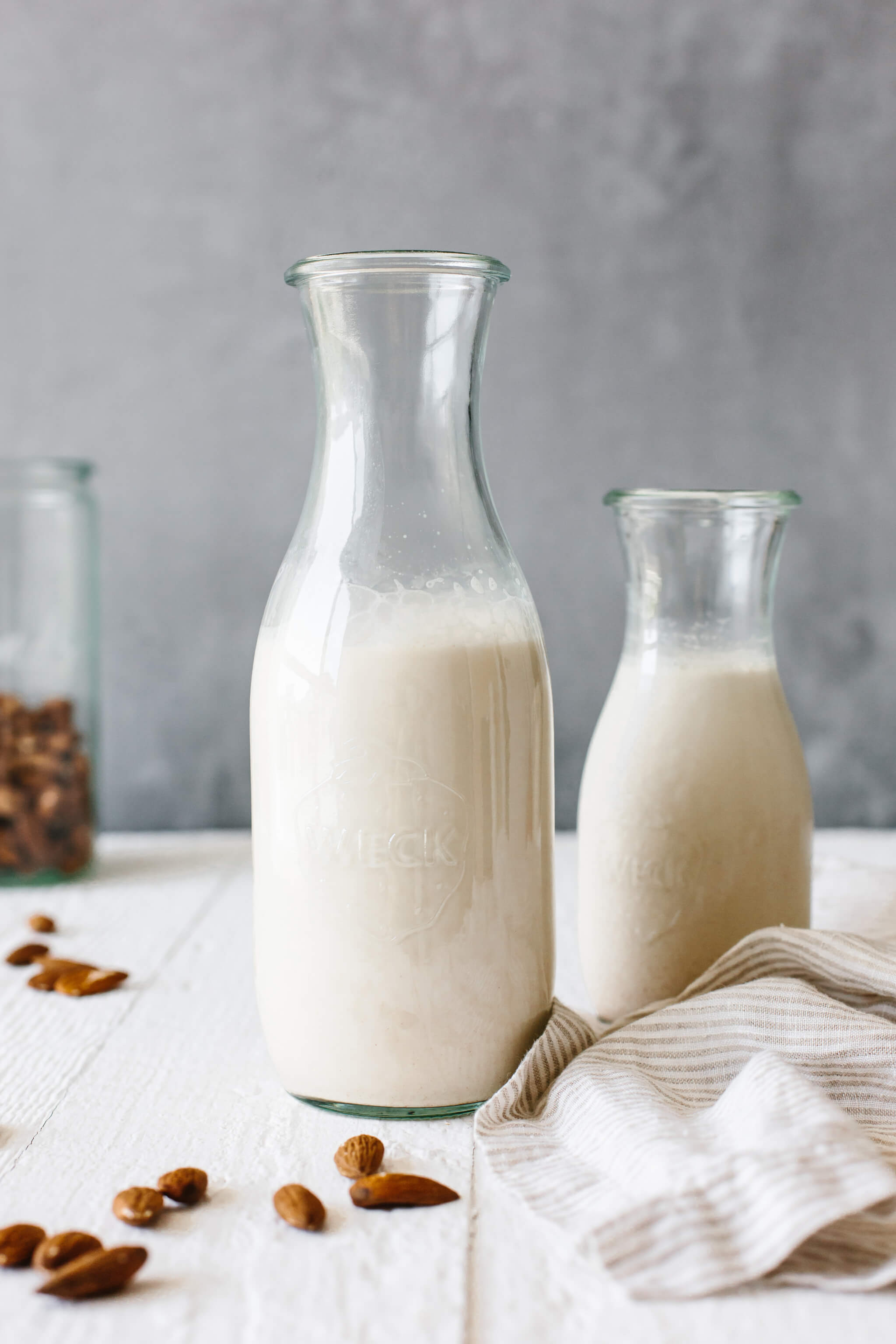 Homemade almond milk in a glass container.