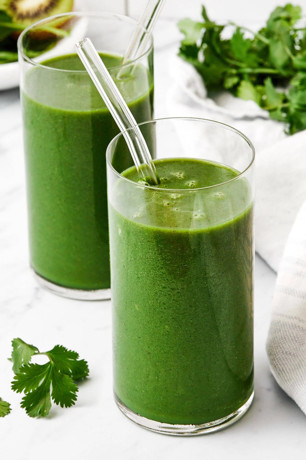 Two glasses of cilantro smoothie