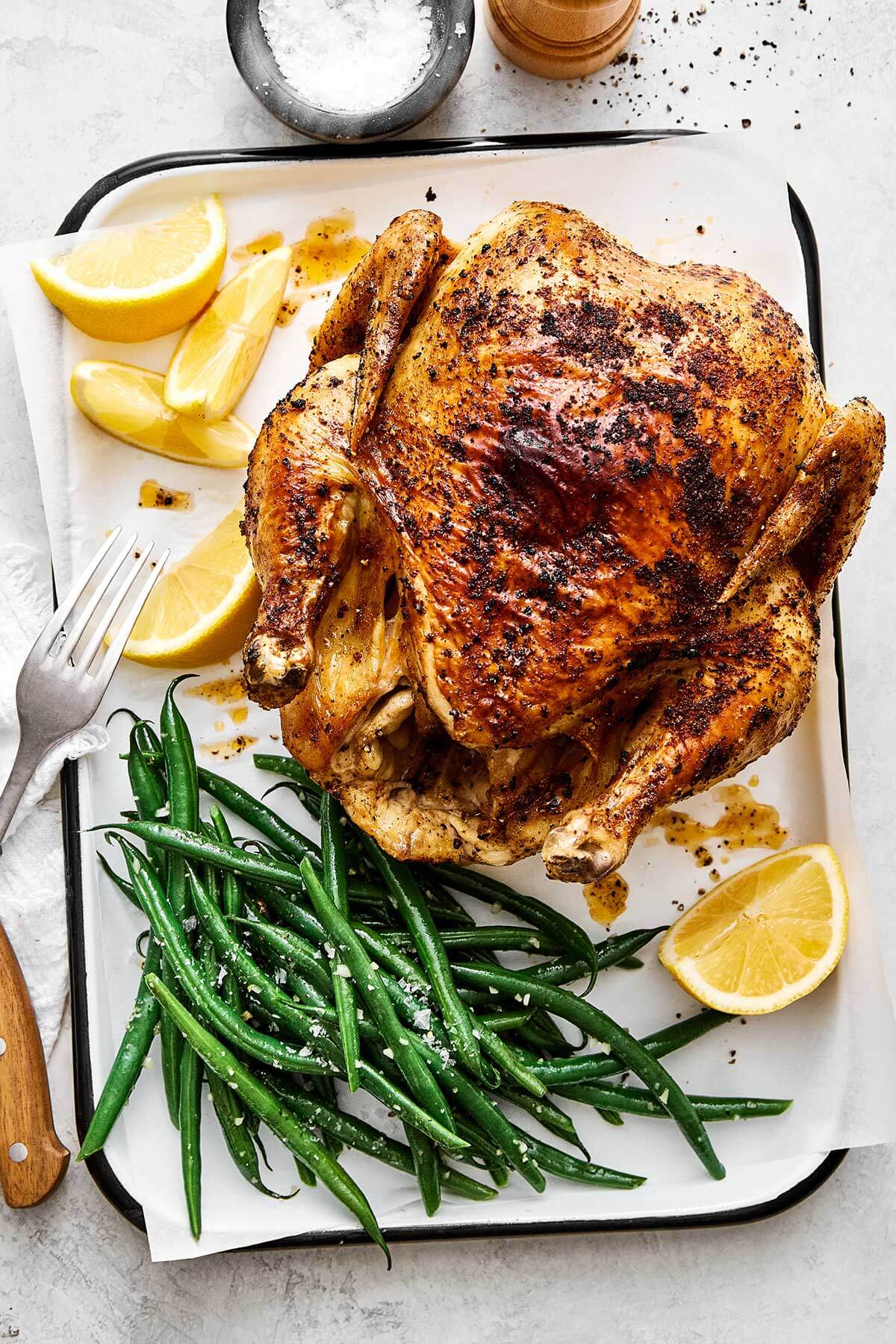 Air fryer whole chicken with green beans.